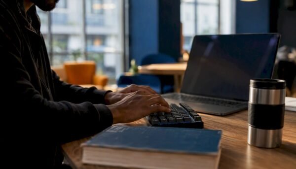 Hands typing Python cybersecurity code